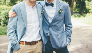 father and groom wearing wedding themed clothes for a wedding