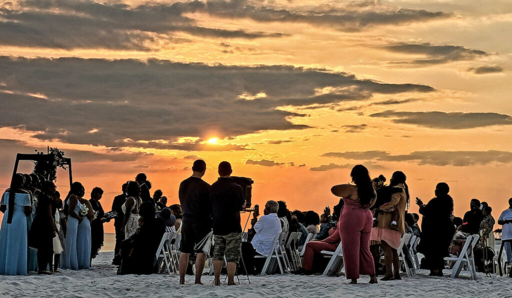 A planned beach wedding at sunset on the beach has been accomplished