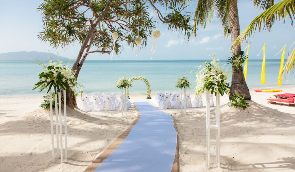 Beautiful beach wedding venue decoration with panoramic ocean view background 