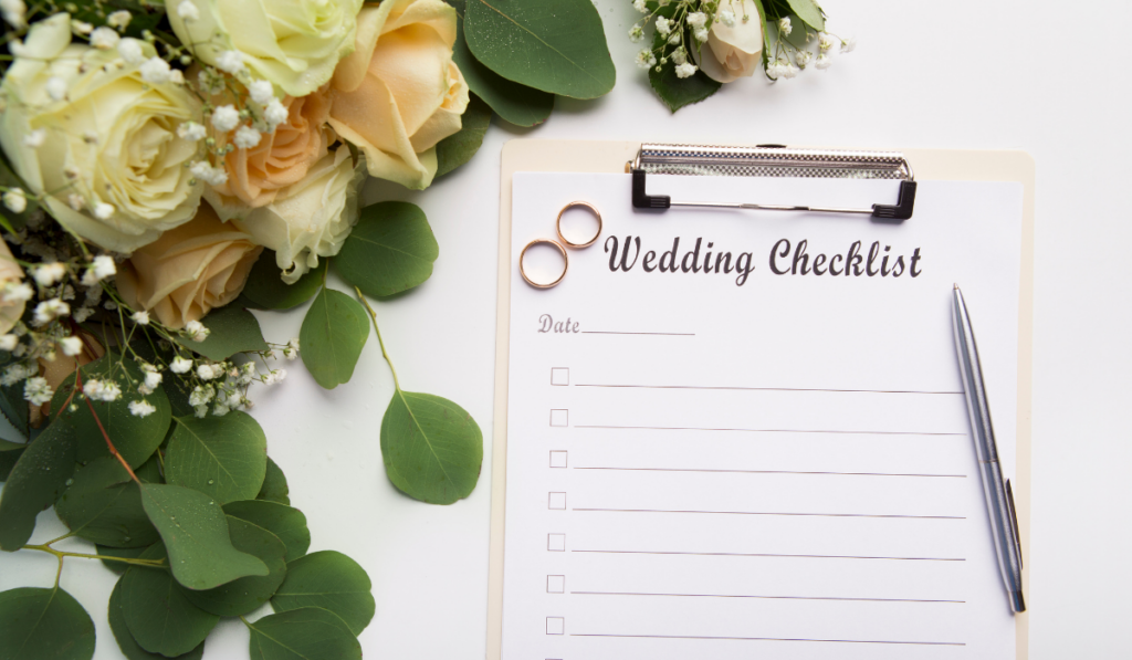 Creative wedding planning checklist with roses and rings