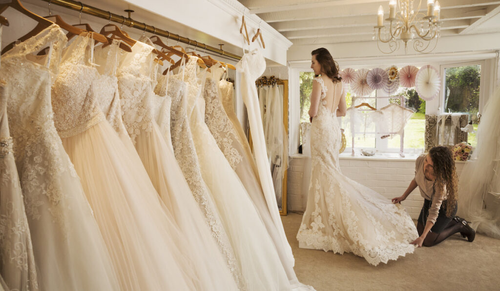 Rows of wedding dresses on display in a specialist wedding dress shop