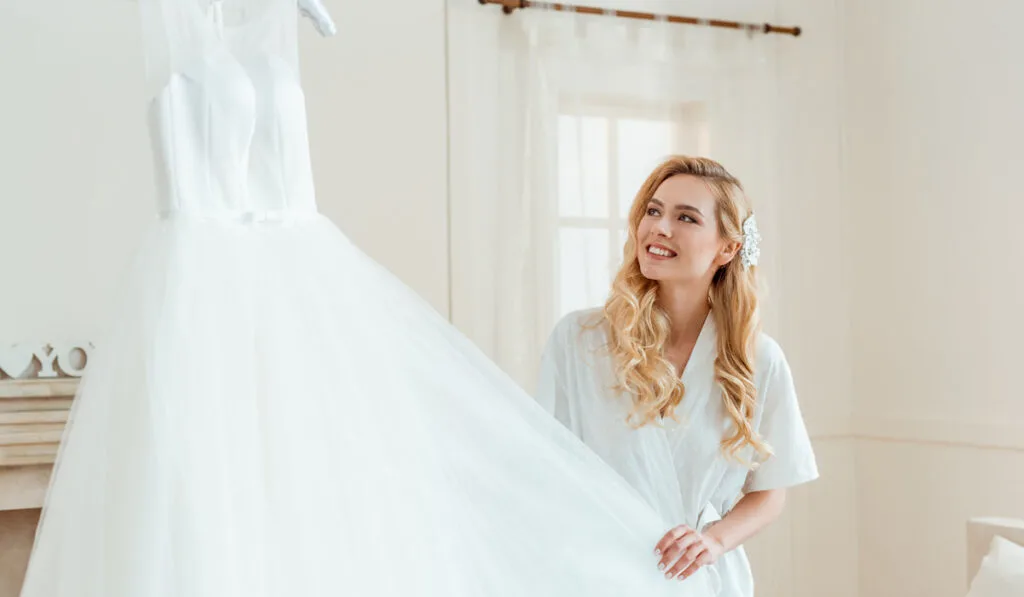 young happy woman with her  beautiful white wedding dress