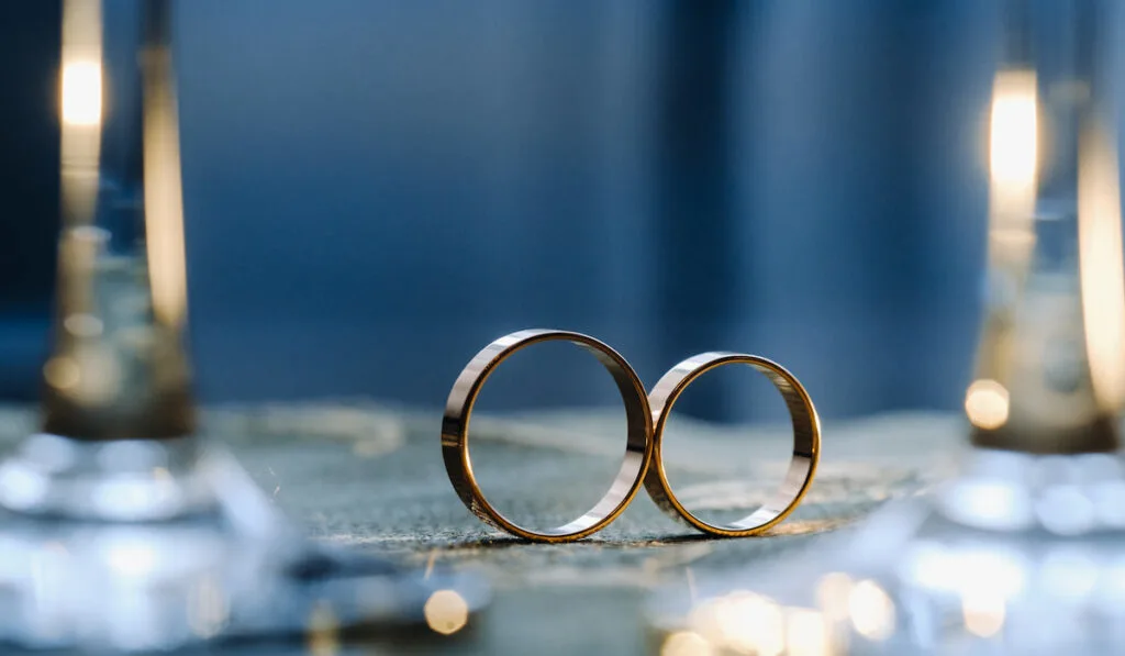 A pair of gold wedding rings.
