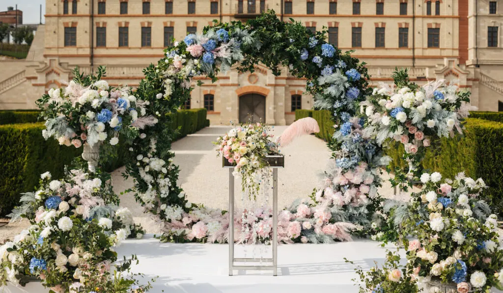 Beautiful wedding arch decoration with blue and pink flowers