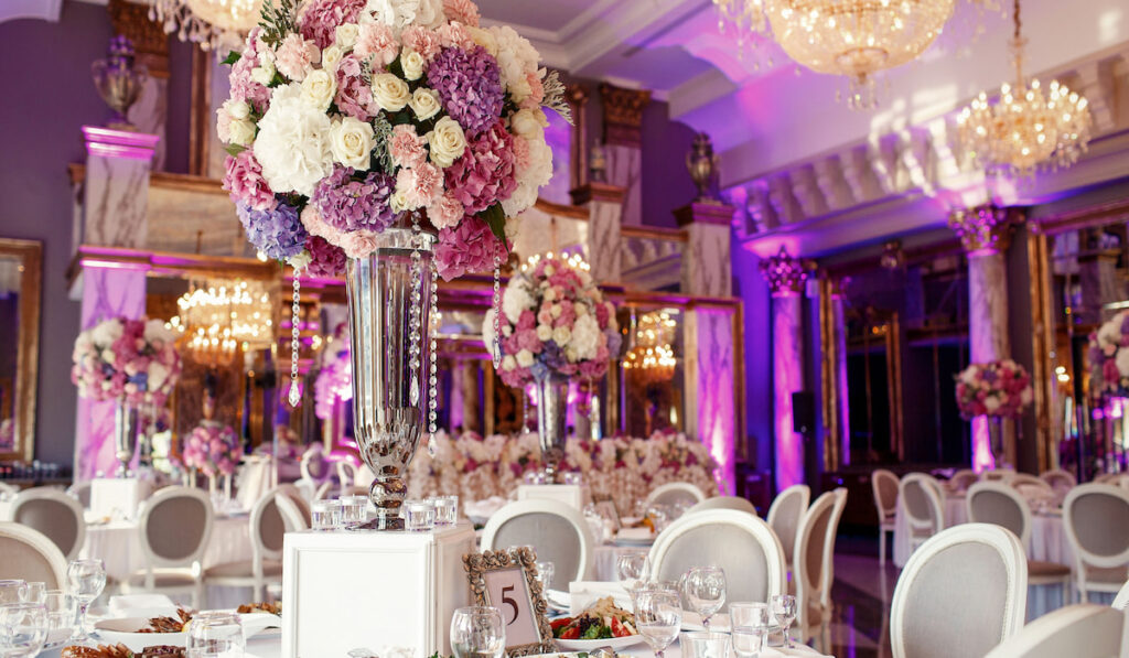 Big wedding venue decorated in pink and violet 