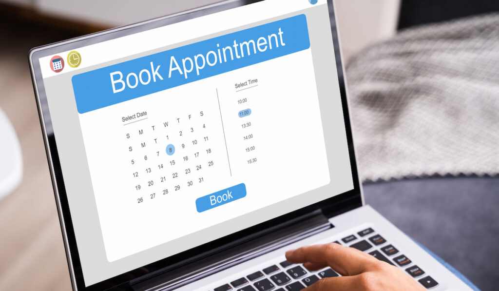 Booking appointment online using a laptop