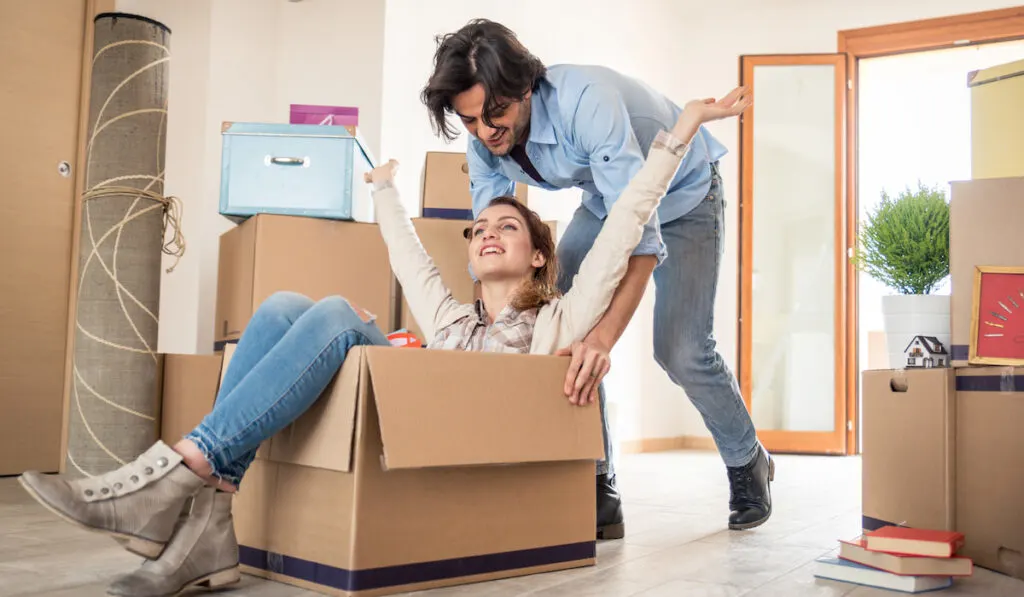 Couple moving into new house
