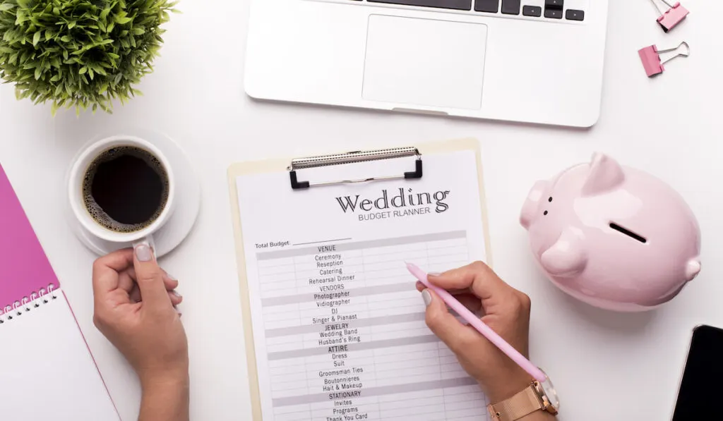 Planning budget before wedding writing ideas on paper

