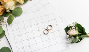 Planning wedding date in calendar, gold rings