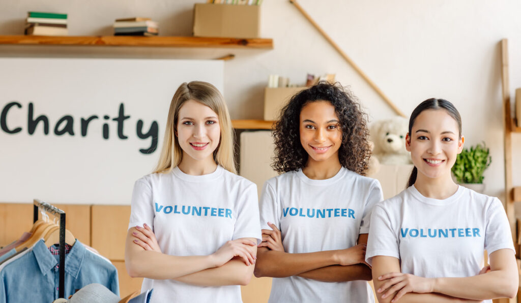 Three girls volunteering to help charity