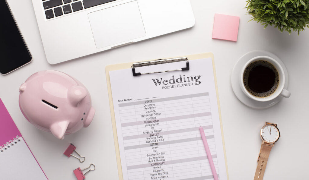 Wedding budget planning on workplace with laptop
