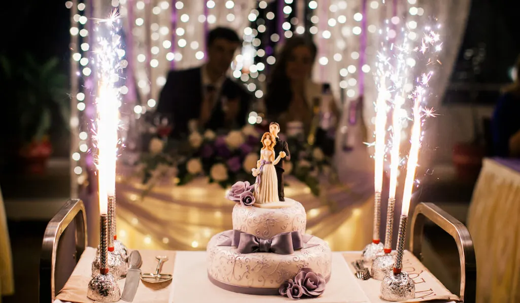 Wedding cake with blurry image of bride and groom on background