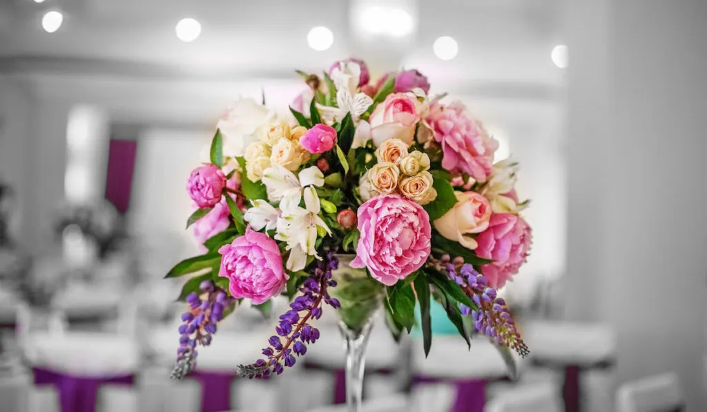 artificial flowers table decoration on wedding reception