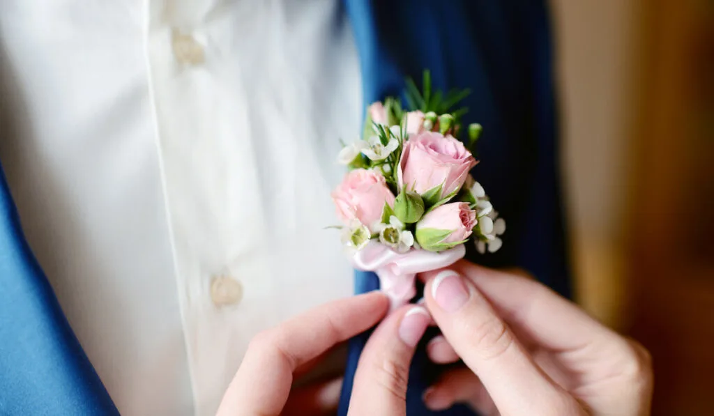 bride-fixing-Boutonniere-for-his-groom