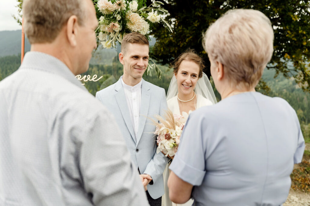 wedding couple talking to parents giving advice