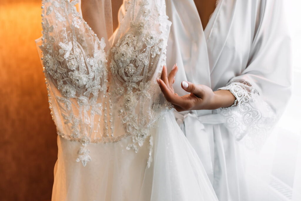 Bride holding wedding dress