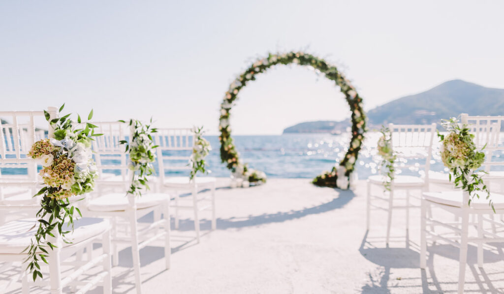 White wedding reception venue with sea and mountains view 