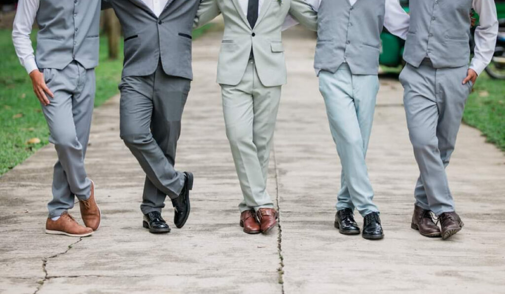 cropped photo of groomsmen on their matching suit