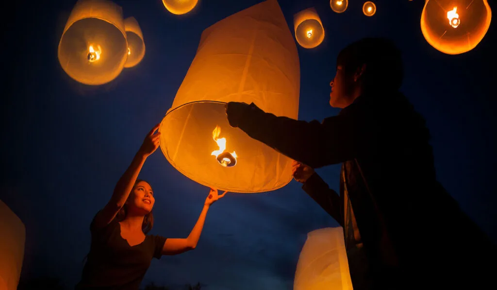 guests holding Floating Lanterns