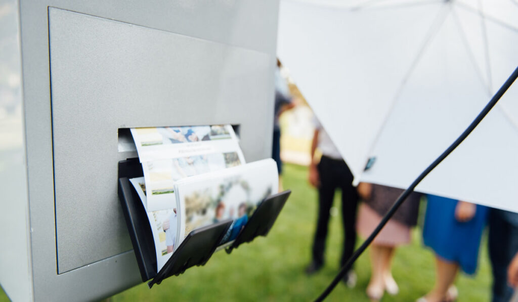 photo booth for instant photos at an outdoor wedding 