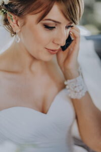 Beautiful bride in a car talking on the phone - ss220806