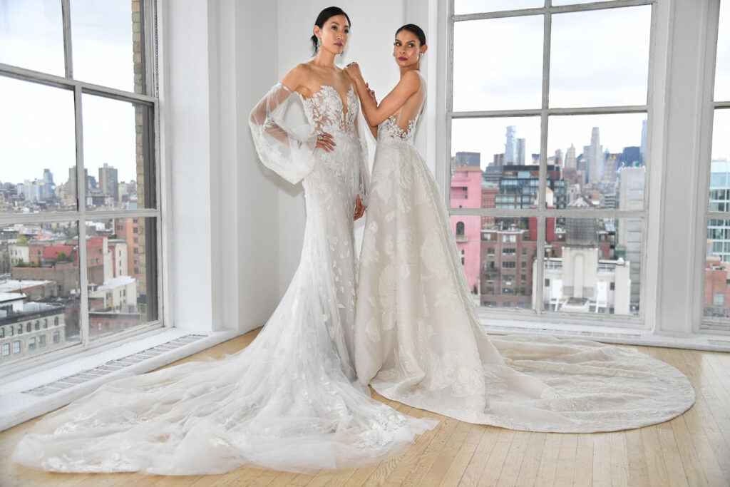 Two Stylish brides posing, one bride with Embellished Sleeves added on her wedding dress