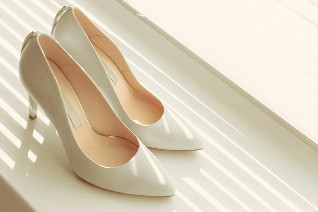 beautiful plain white shoes on white surface