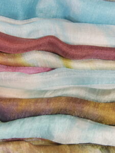 Multi-colored uzbek silk fabrics stacked - ee220805