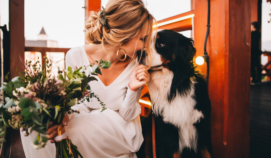 Bride on her wedding day and her favorite dog,