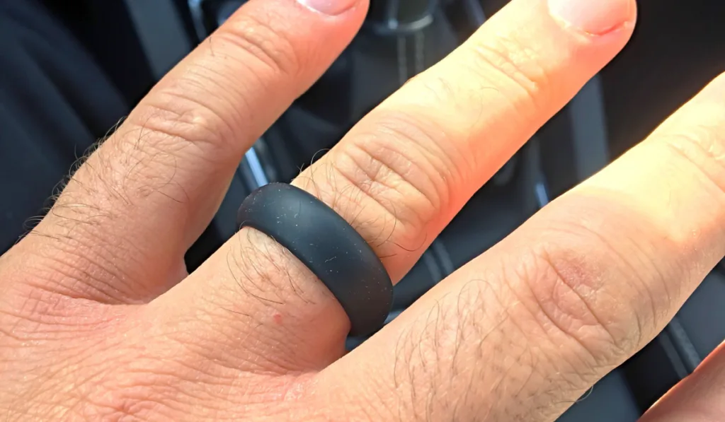 Black silicon wedding band on males left hand