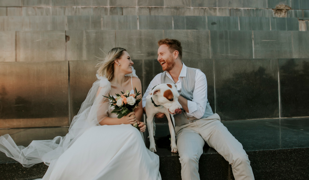 Young newlywed couple with their Jack Russel Terrier dog
