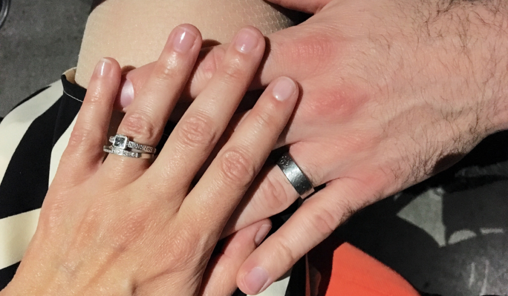 wedding ring band on couples hand