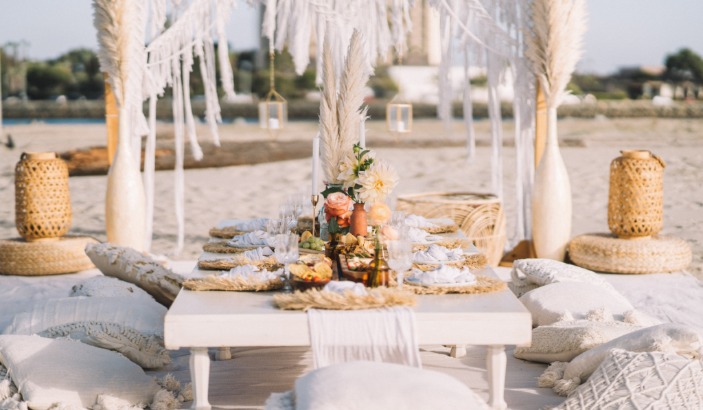 Bohemian style beach wedding themed picnic set up
