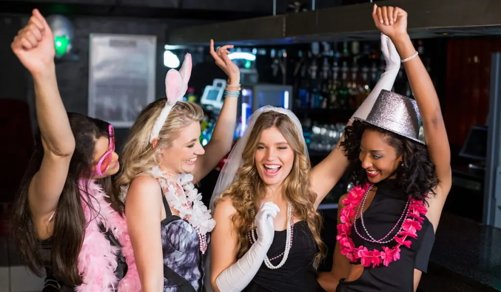 Friends celebrating bachelorette party in a nightclub