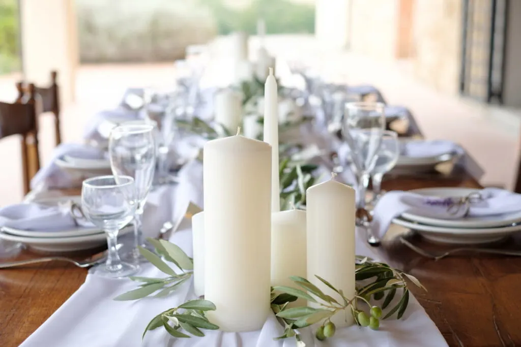 White candles on wedding table
