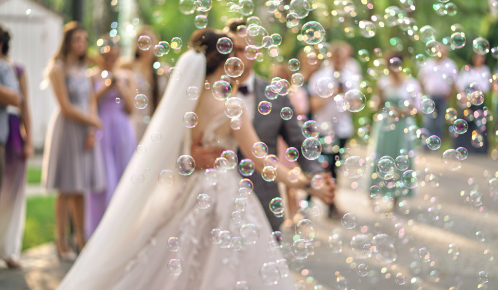 Soap bubbles blurred in the background of the bride