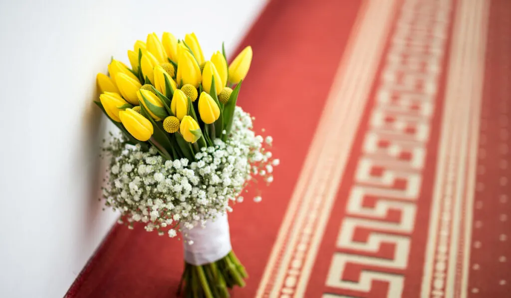 Beautiful wedding bouquet of yellow spring tulips in the hotel hallway