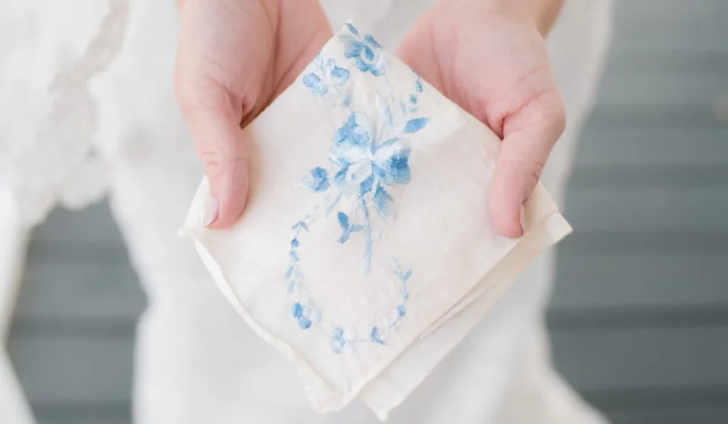 Vintage handkerchief held by bride