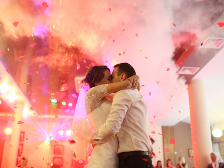 Romantic kiss on the dancefloor during the wedding party