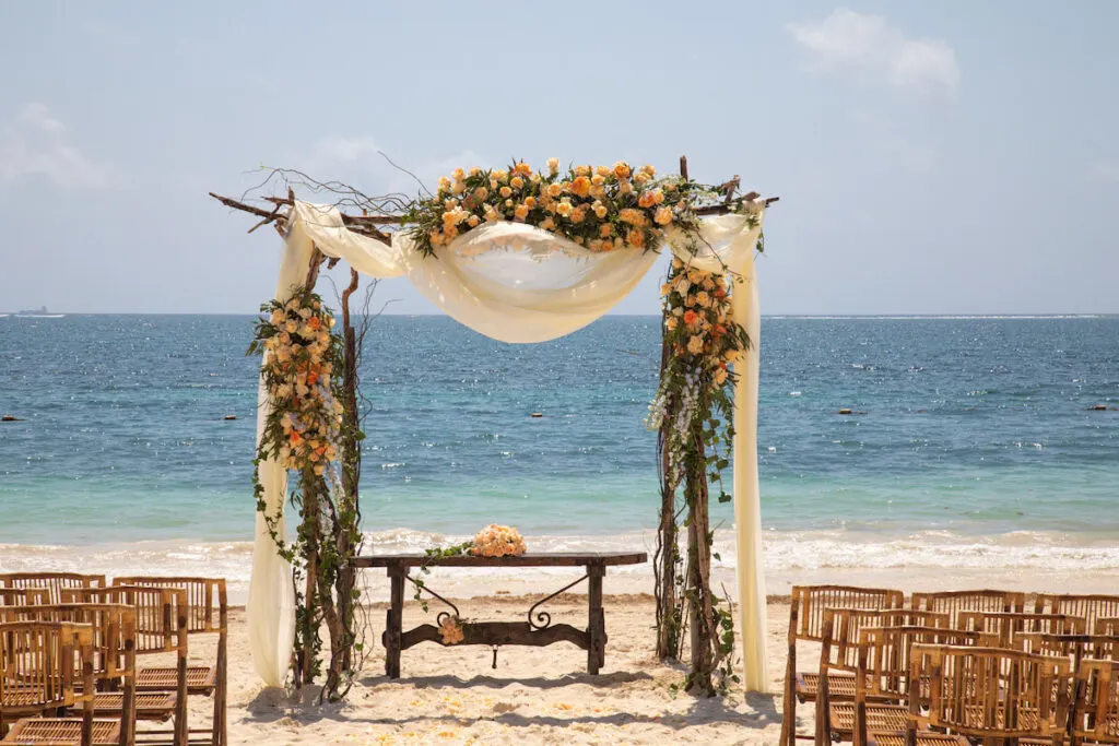 combined light colored wedding decoration at a beach