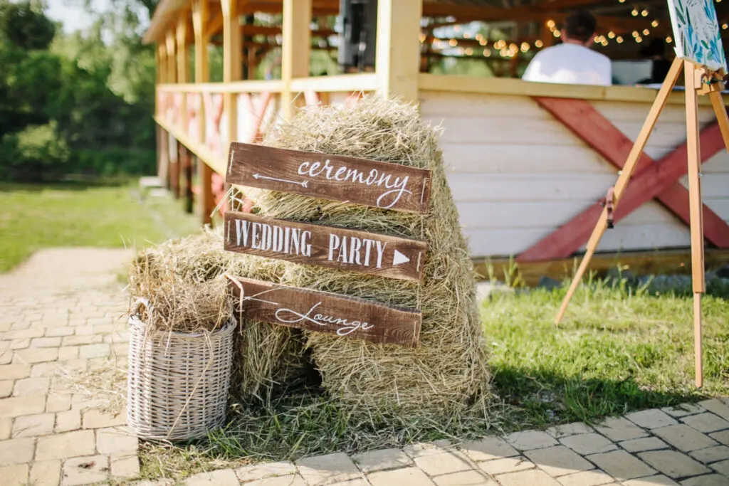 wedding signage on a hay stack